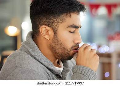 This Cough Is Getting Bad. Cropped Shot Of A Young Man Coughing.