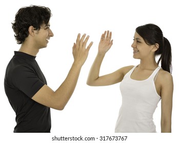 This Couple Hi Five And Smile They Have A Sport Clothes.