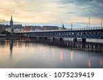 This is Craigavon bridge Derry Ireland that crossed the river Foyle. It is one of only a few double-decker bridges in Europe. The photograph was taken at sunset just after the sun went down.