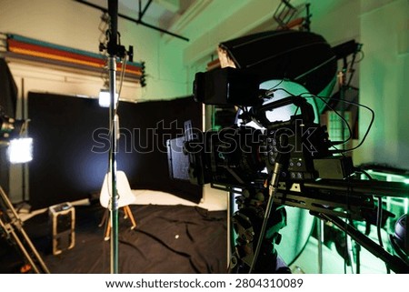 This creative studio features a professional camera ready to capture heartfelt interviews or thought-provoking podcasts.