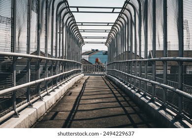 This crossing bridge is very empty, not a single person is crossing it in the afternoon