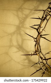 This Crown of Thorns against parchment paper represents Jesus' Crucifixion on the Cross, dying and then rising on Easter Sunday.  The shadow of the Crown of Thorns on the parchment adds to the visual.