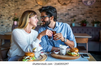 This is so delicious. Young couple eating together in the restaurant. Love, dating, food, lifestyle concept - Shutterstock ID 2160355297