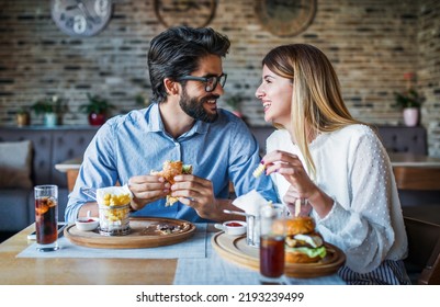 This is so delicious. Young couple having breakfast in a cafe. Love, dating, food, lifestyle concept - Shutterstock ID 2193239499