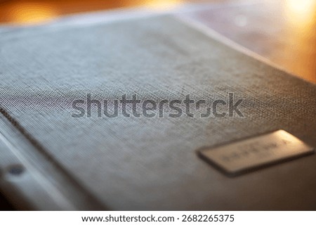 This is a detailed closeup image showcasing a book that features a label prominently displaying the letter a on it, emphasizing its distinctiveness