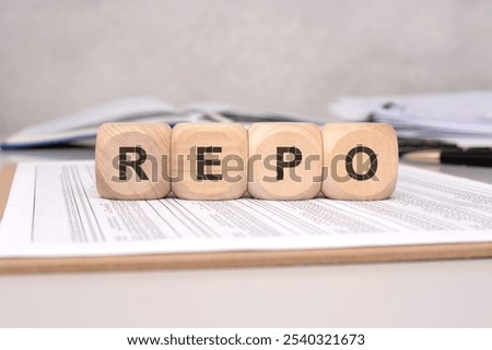 this is a detailed and creative representation of the term REPO used in finance, placed strategically on documents