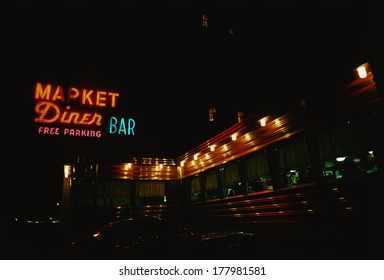 This Is A Diner On The Westside Highway. It Has Neon Lights On The Outside.