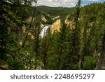 This is a distant view of Upper Yellowstone Falls in Yellowstone National Park in Wyoming.