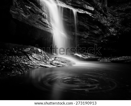 This dramatic black and white artistic waterfall is one of many waterfalls in the state of North Carolina which is known for beautiful scenery.