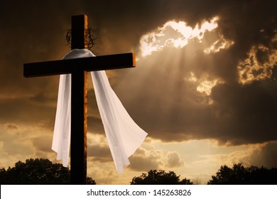 This dramatic lighting with storm clouds breaking and sunshine bursting through makes a great Easter photo illustration of Jesus dying on the cross and rising again.
