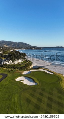 This drone image captures Pebble Beach Golf Course and Carmel-by-the-Sea. Beautiful image for golf lovers and scenic enthusiasts. This image was taken by a drone at golden hour on the central coast.