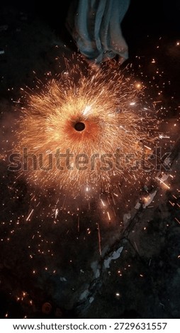 This dynamic vertical photograph captures a ground-based firework, likely a 