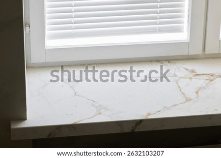 This Elegant Marble Window Sill features Natural Patterns that enhance its appeal