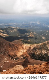 This elevated view captures the lush valleys nestled between lofty peaks, highlighting the serene beauty and breathtaking scale of the mountainous landscape.