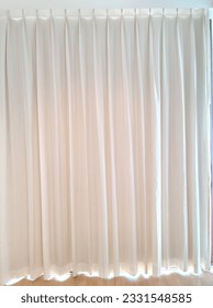 This exquisite photograph captures the essence of elegance and sophistication with its portrayal of graceful white curtains. The image showcases a pair of immaculate white curtains, delicately hanging - Shutterstock ID 2331548585