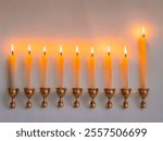 This features a menorah with lit candles, traditionally associated with Hanukkah, a Jewish festival. It