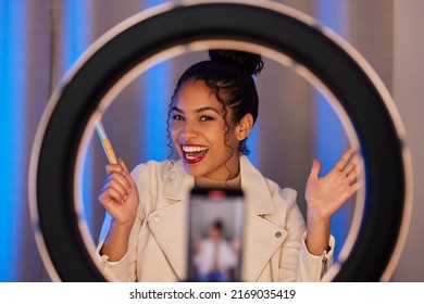 This Is The Final Look. Shot Of A Young Woman Using A Phone And Ring Light To Film A Makeup Tutorial At Home.