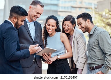 This Is The Final Result. Shot Of A Diverse Group Of Businesspeople Standing Outside Together And Using A Digital Tablet.