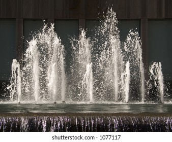 This Is A Freeze Frame Shot Of Water Splashing Out Of A Fountain.