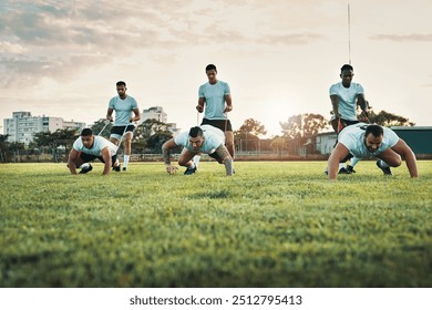 In this game you should never look back. Full length shot of a group of young rugby players training with bands on the field during the day. - Powered by Shutterstock