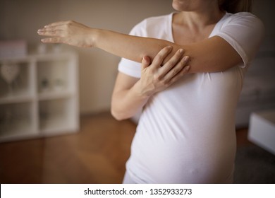 This is good for her hands and back. Pregnant woman working exercise.