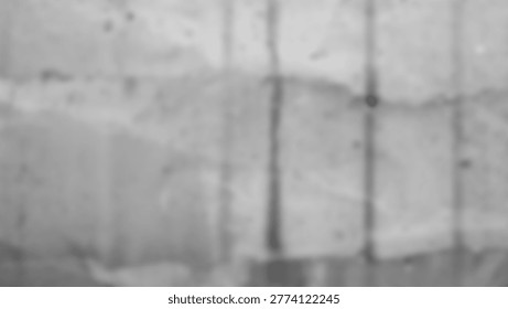 This is a grayscale abstract texture of a wall with lines and shadows. The image is a close-up of a textured surface, with a blurred focus. The lines and shadows create a pattern.