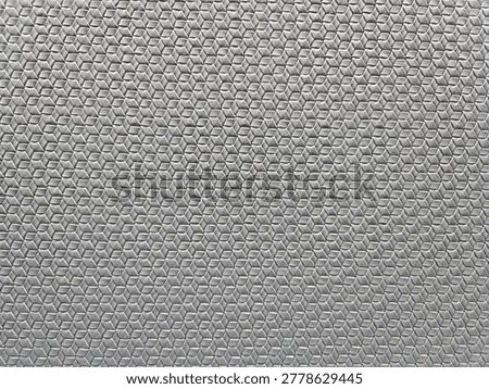 This is a grey geometric patterned textile or vinyl wallcovering. 