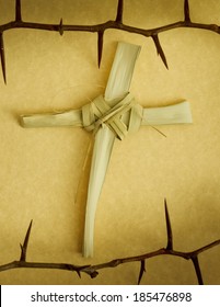 This Handmade Cross Of Palm Branch Leaves, Surround By A Crown Of Thorns Represents Palm Sunday, Jesus's Good Friday Crucifixion And His Rising On Easter Sunday