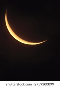 This high-quality visual captures the stunning detail of a Crescent Moon shining brightly against the dark Night Sky. As a beautiful Celestial body, the Crescent Moon represents the peaceful transition of lunar phases. The soft glow from the Crescent Moon illuminates the surrounding Night Sky with a serene, silver light. Observed as a sharp Celestial object, this view showcases the intricate craters and surface of the Crescent Moon clearly. This Celestial imagery is perfect for themes involving the Night Sky, astronomy, or spiritual moments. This sharp Celestial view is a perfect addition to any creative project focused on the Night Sky.
