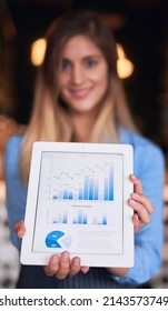 This Is How I Measure Success. Cropped Portrait Of An Attractive Young Woman Showing You Her Coffee Shop Graphs On A Digital Tablet.