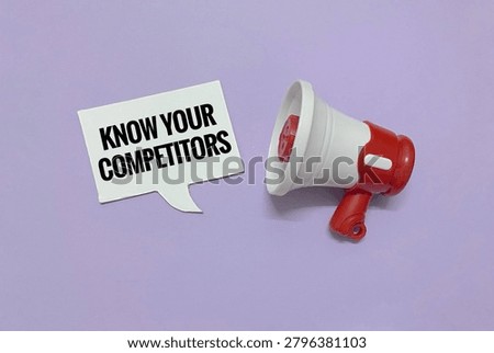 This image appears to be a stylized stock photo showcasing a red and white megaphone alongside a sign that reads 
