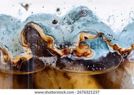 This image appears to show a close-up of a frozen drink with a layered appearance possibly a slushie or a frosty beverage