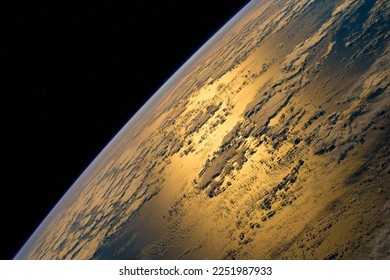 In this image from April 10, 2022, sunlight glints off the Atlantic Ocean in this photograph from taken by the crew of the International Space Station.Elements of this image furnished by NASA. - Powered by Shutterstock
