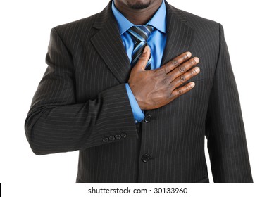 This is an image of business man with hand across his chest.