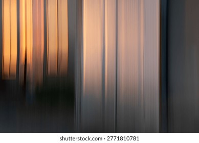 This image is a captivating example of Intentional Camera Movement (ICM) photography, featuring a vertical motion blur that transforms a physical structure into an abstract tapestry of light and color. The composition is dominated by warm, glowing ambers and soft, ethereal creams, contrasted against deep, muted shadows at the base. The vertical lines create a sense of rhythmic upward energy, blurring the boundary between architectural reality and painterly expression.
The mood is contemplative, serene, and sophisticated. The golden hour hues evoke a sense of fleeting time and warmth, while the soft, blurred textures provide a dreamlike, almost meditative quality. It feels both modern and timeless, stripping away detail to focus entirely on the emotional resonance of light.  Perfect as large-scale abstract wall art for modern offices, luxury hotel lobbies, or minimalist living spaces.
A high-end background for wellness websites, architectural journals, or literary magazine covers. Ideal for brand storytelling focused on fluidity, transition, innovation, or elegance. A calming backdrop for meditative apps, presentation slides, or social media quote cards.