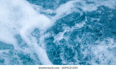 This image captures the dynamic movement and texture of water, creating an abstract and refreshing visual