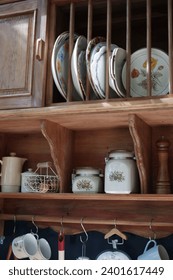 This image captures the essence of a charming, old-fashioned store, where an array of vintage and handcrafted items are displayed in the window