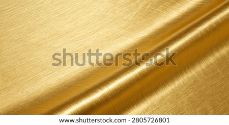 This image captures the exquisite texture and lustrous quality of draped gold metallic fabric, emphasizing its luxurious feel and visual appeal.