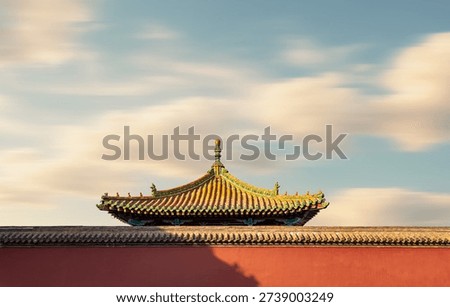 This image captures the iconic red wall and golden glazed tile roof of Shenyang Imperial Palace, a masterpiece of traditional Chinese imperial architecture from the Qing Dynasty. The upturned eaves are adorned with mythical beast sculptures, while the long-exposure technique creates soft, flowing clouds against the warm dusk light. This historic landmark, a UNESCO World Heritage site, embodies the grandeur of ancient Chinese imperial culture and is a renowned destination for cultural tourism and architectural photography in Northeast China.