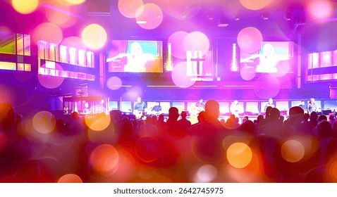 This image captures a large indoor event space filled with people standing; crowd, modern worship service, Christian