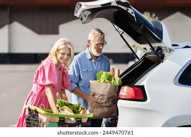 This image captures a senior married couple as they load groceries into their car, illustrating a routine but joyful errand - Powered by Shutterstock