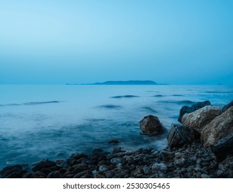 
This image captures the serene beauty of a rocky beach in Heraklion, Crete, Greece, as the calm waters of the Mediterranean gently lap against the shoreline. The tranquil seascape showcases the subtl - Powered by Shutterstock