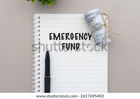 This image captures a small reserve of money accompanied by a note reading “Emergency Fund,” showcasing the concept of financial foresight.

