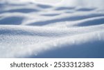 This image captures soft ridges of snow reflecting diffused light, creating a serene winter landscape. Perfect for enhancing winter themes or nature-related projects.