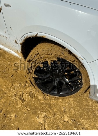 This image conveys the struggle of navigating difficult terrains and the unpredictability of off-road driving