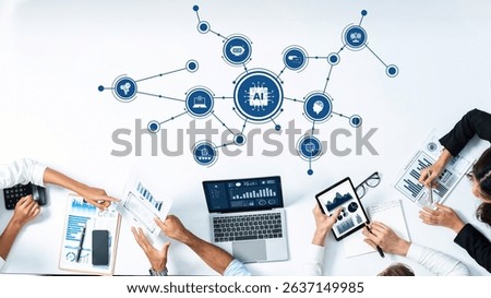 This image depicts a collaborative workspace where professionals analyze data for artificial intelligence development, showcasing technology and teamwork for impactful business strategies. Amity