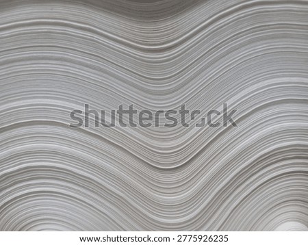 This image displays a close-up of a massive paper roll or jumbo roll, a common sight in the pulp and paper manufacturing industry.