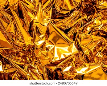 This image features a close-up view of a pile of wrinkled gold foil.
The foil is shiny and reflective, and the wrinkles create a textured and interesting surface.
for many uses ...