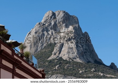 This image features the Peña de Bernal, a stunning monolithic rock formation located in Querétaro, Mexico.