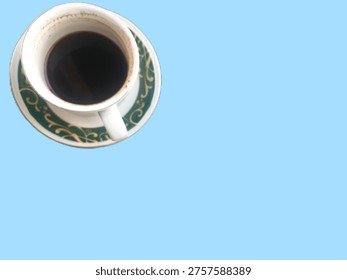This image features a high-angle, top-down view of a demitasse cup and matching saucer set against a solid light blue background.